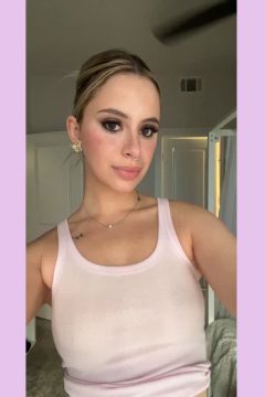 amateur blonde babe with boobs in braless tank top