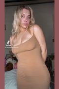 sexy hot girl with big tit sin tight braless dress