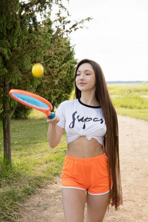 hot brunette plays tennis